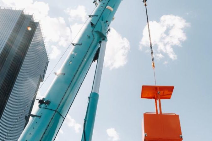 a-large-blue-truck-crane-stands-ready-for-operatio-2021-09-04-05-36-25-utc