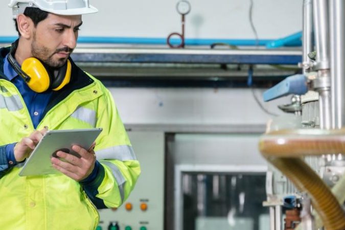 young-male-machine-inspector-wearing-vest-and-hard-2022-12-16-02-13-56-utc